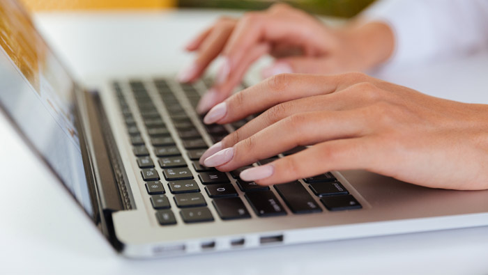 Laptop with person typing