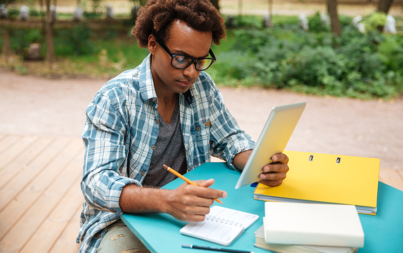 Student with laptop doing homework